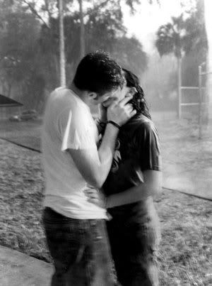 romantic couple kissing in the rain. romantic couple kissing in the